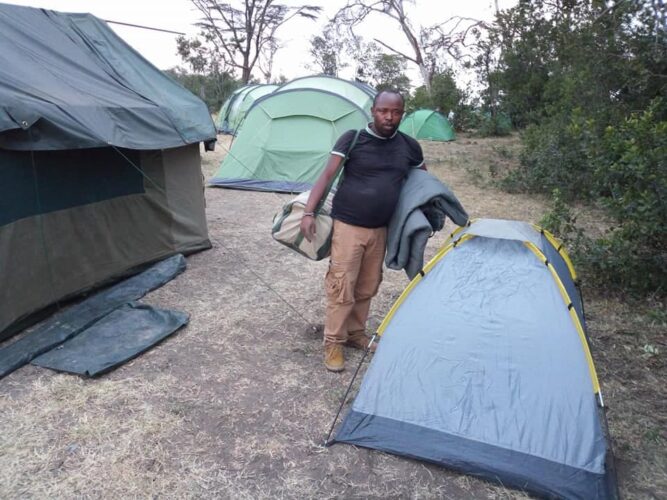 Camper preparing to enter a mobile tent on a Nairobi Aberdare Samburu Meru Laikipia mobile camping safari