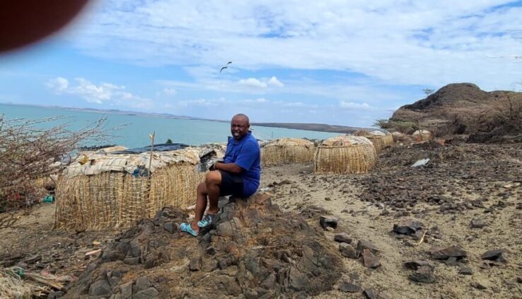 Elmolo Village on the 10-Day Luxury Helicopter & Flight Off-the-Beaten-Path Kenya Safari Elmolo man in Elmolo village overlooking Lake Turkana on the 10-Day Luxury Helicopter & Flight Off-the-Beaten-Path Kenya Safari
