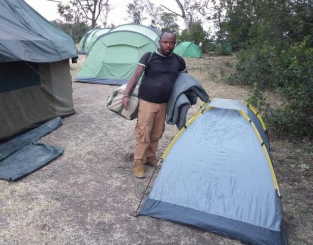 African Affarble Expeditions Authentic Mobile Camping Setup in Kenya | African Affarble Expedition Limited Kenya Safari crew setting up an authentic mobile camping tent in Kenya wilderness with African Affarble Expedition Limited during Kenya Budget Safari Packages