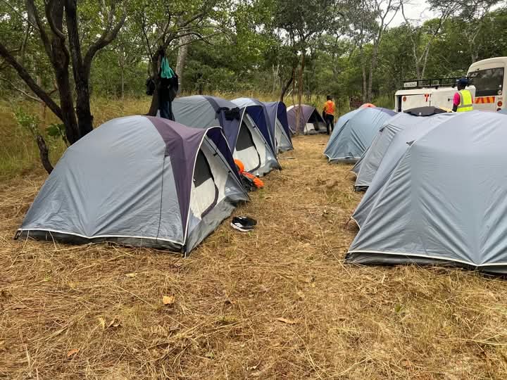 Safari crew setting up an authentic mobile camping tent in Kenya wilderness with African Affarble Expedition Limited