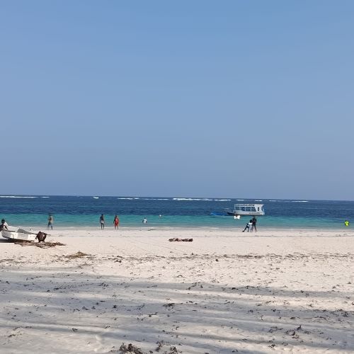 Pristine sandy beach with turquoise waters along the Kenyan coast on a romantic beach holiday